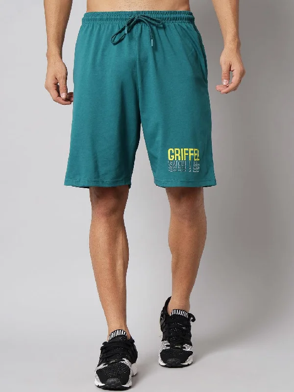 Men's pastel - colored cotton shorts for a spring - friendly outfitGRIFFEL Men Basic Solid Bottle Green Regular fit Shorts