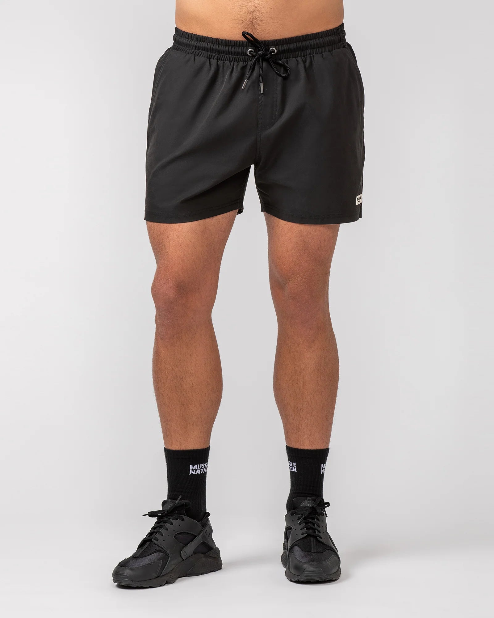 Men's flat - front chino shorts for semi - formal summer eventsMuscle Nation | Daily 4" Shorts - Black